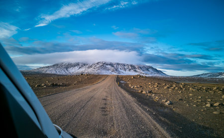Car frame driving over the track with mountain in the backgroundの写真素材