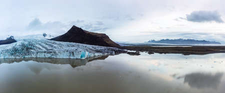 Glacier lake panoramic view with massive glaciar tongue