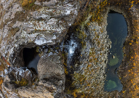 Top view of Asbyrgi canyon waterfall and streamの写真素材