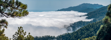 Spectacular sea of clouds panorama under the mountain rangeの写真素材