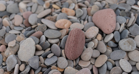 Rounded stones background with different colors, top viewの写真素材