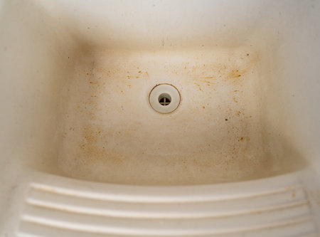 Stained and Dirty White Sink with Years of Neglectの写真素材