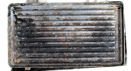 Old, rusty and broken sandwich maker, ready for disposalの写真素材