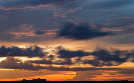 Long Exposure Sunset Sky with Mesas Silhouetteの写真素材