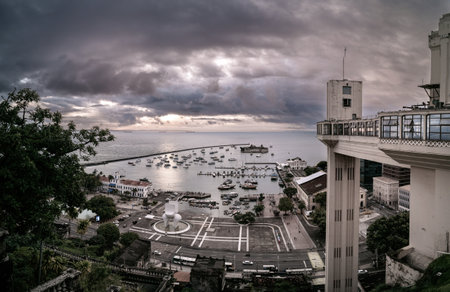 Vintage view of Lacerda elevator in Salvador at dusk with clouds over the seaの写真素材