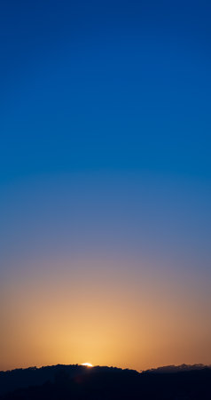 Breath-taking View of Sunrise over Mountain Range with Spacious Skyの写真素材