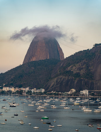 Misty Sugarloaf Mountain Overlooking Tranquil Bay Areaの写真素材