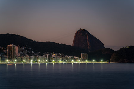 Twilight Skyline of Coastal City with Sugarloaf Mountainの写真素材
