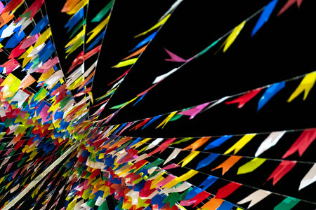 Colorful Abstract Ribbons Streaming Across a Dark Backgroundの写真素材
