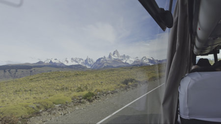 Scenic Mountain View Through a Bus Window on a Tripの写真素材