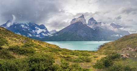 Majestic Mountain Landscape Overlooking a Turquoise Lakeの写真素材