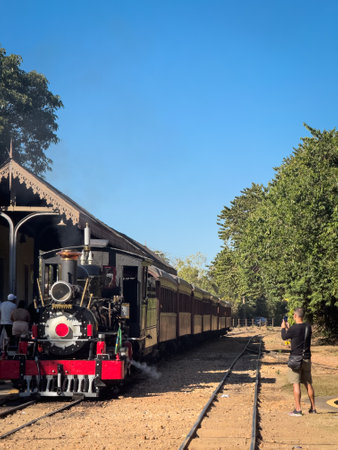 Man Capturing the Essence of Vintage Train Journeyの写真素材