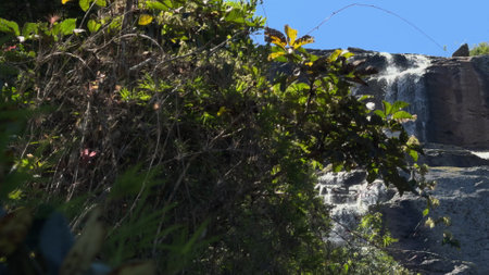 Slow Motion Slide to a Rust-Colored Multi-Level Waterfallの写真素材