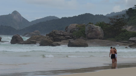 Couple Playing in Slow Motion on Lopes Mendes Beach, Brazilの写真素材