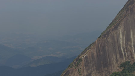 Hiking on the dangerous cliff edge of Escalabrado Mountain in Rio de Janeiroの写真素材