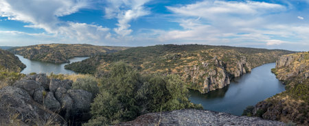 Breathtaking Canyon View with Serene River Landscapeの写真素材
