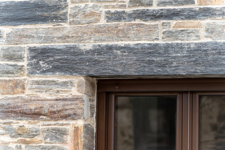 Rustic Stone Wall with Modern Window Frameの写真素材