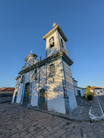 Historic Church with Charming Facade at Sunsetの写真素材