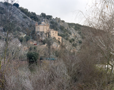 Historic Monastery Nestled in Rocky Hillside Landscapeの写真素材
