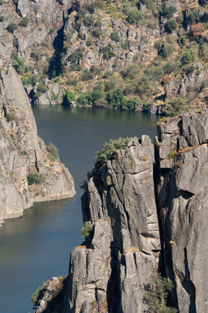 Majestic River Canyon Surrounded by Steep Cliffsの写真素材