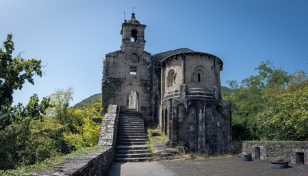 Ancient Stone Chapel Amidst Lush Greeneryの写真素材