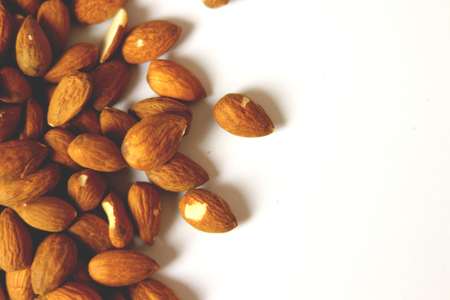 Dried pistachio nuts in class with brown backgroundの写真素材