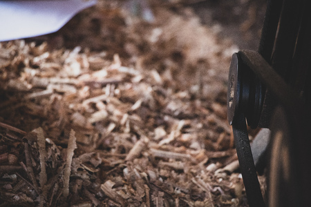 Carpenter working with circular saw woodworking machine in a carpentryの写真素材
