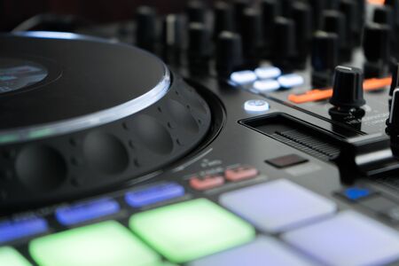 Close up DJ mixer player and sound console for house music partyの写真素材