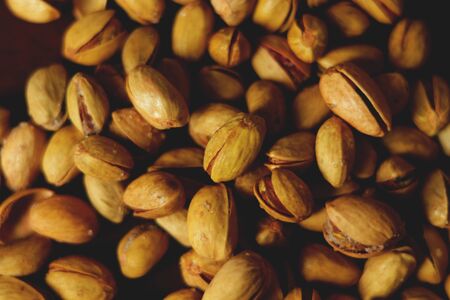 Dried pistachio nuts on tableの写真素材