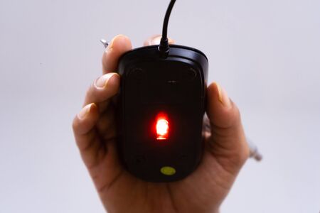 Female hand holding computer mouse