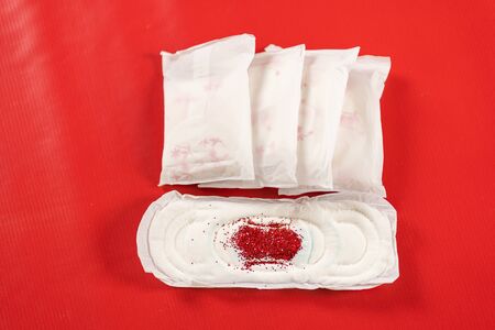 close up of woman hygiene protection on red backgroundの写真素材