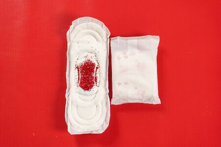 close up of woman hygiene protection on red backgroundの写真素材