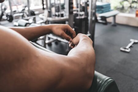 Handsome Muscular Male Model With Perfect Body Doing Biceps Exerciseの写真素材