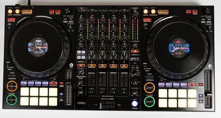 Black modern audio controller and professional headphones. Set of DJ instrument. Top viewの写真素材