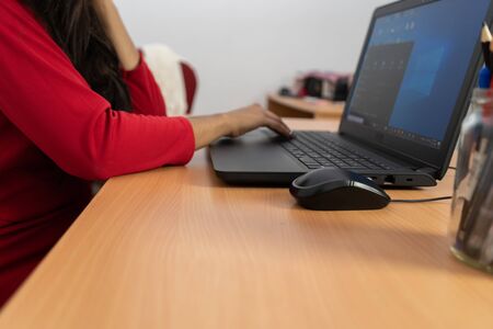 Young pretty business woman with notebook in the officeの写真素材