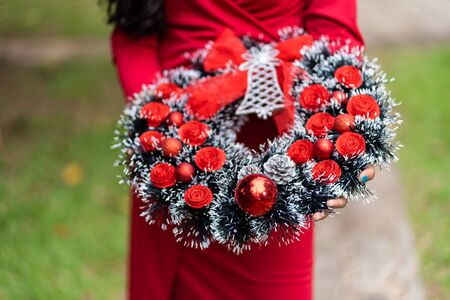 Advent Christmas wreath hold on young ladyの写真素材