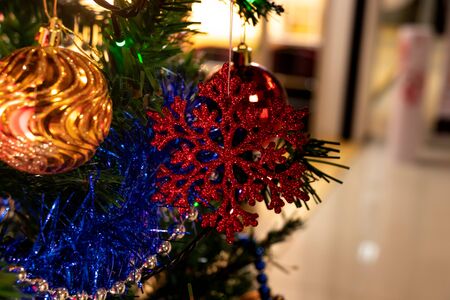 New Year's toys hang on the Christmas tree red toyの写真素材