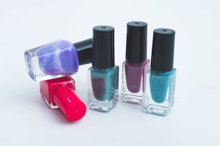 a collage of compositions of nail polish isolated on whiteの写真素材