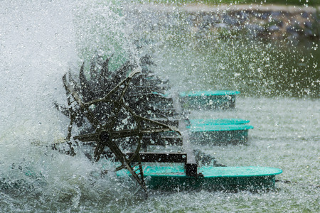 Water turbines are spinning turbines rotate to add oxygen to the water. Speed Shutterの写真素材