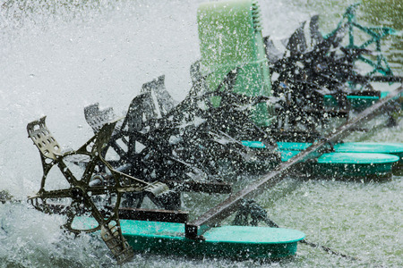 Water turbines are spinning turbines rotate to add oxygen to the water. Speed Shutterの写真素材