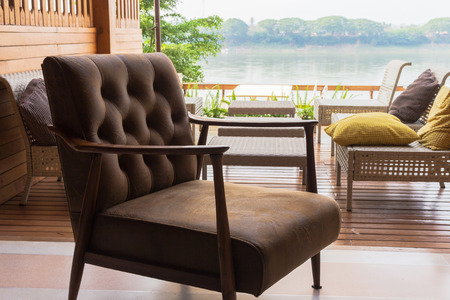Leather chairs for relaxing on the terrace overlooking the river.in Public clubの写真素材
