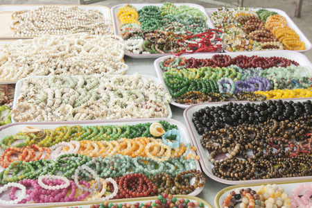 A lot of colorful bracelets, at a marketの写真素材