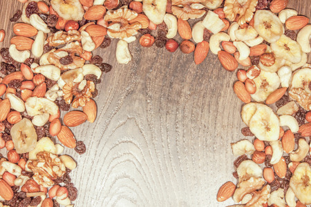 Nut mix food background and place for text, on wooden groundの写真素材