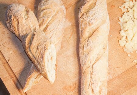 Fresh french baguette, on wooden cutting boardの写真素材