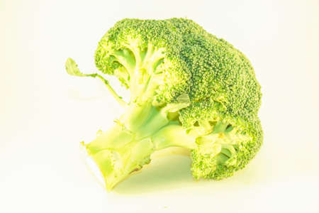 A green broccoli plant, isolated on white background