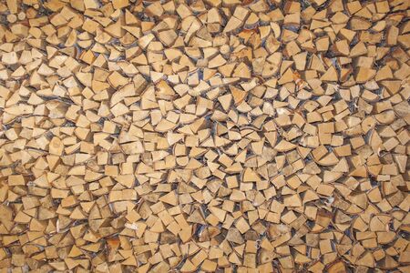 A stack of firewood, in a hutの写真素材