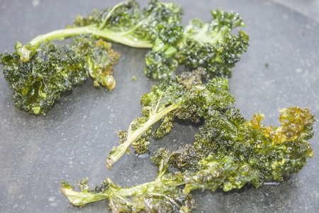 Deep fried kale, on a stone plateの写真素材