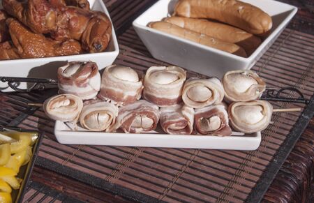Grilled champignons, full of blue cheese and wrapped in baconの写真素材