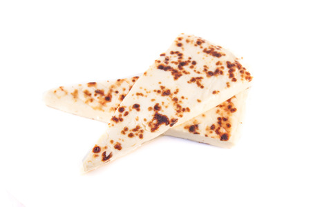 Finnish squeaky cheese, isolated on white backgroundの写真素材