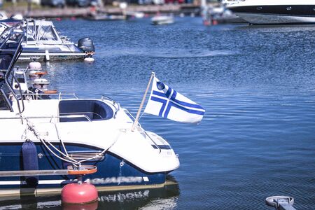Finnish flag on a boat, at Hanko regatta, in Finlandの写真素材